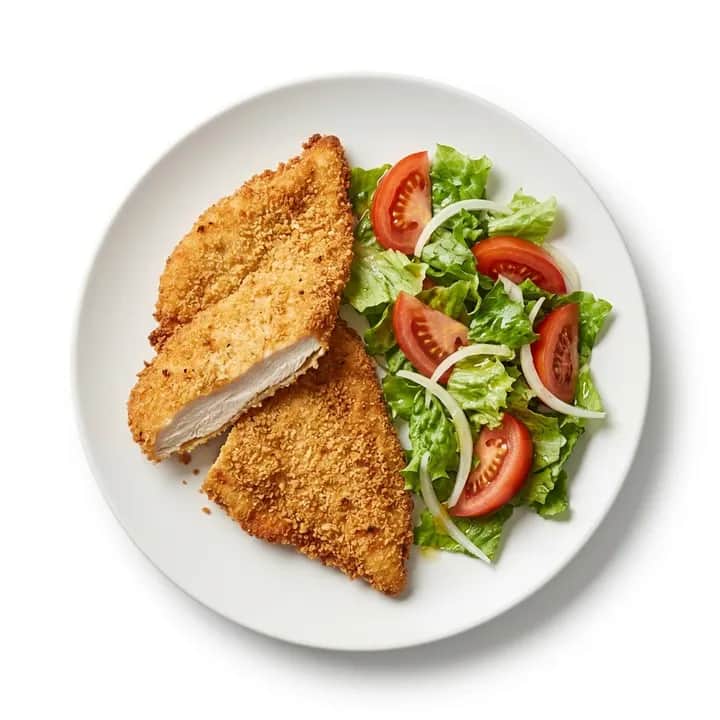 Filete de pollo empanado con ensalada